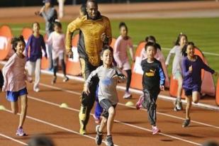 Usain Bolt Lomba Lari dengan Anak-anak di Tokyo